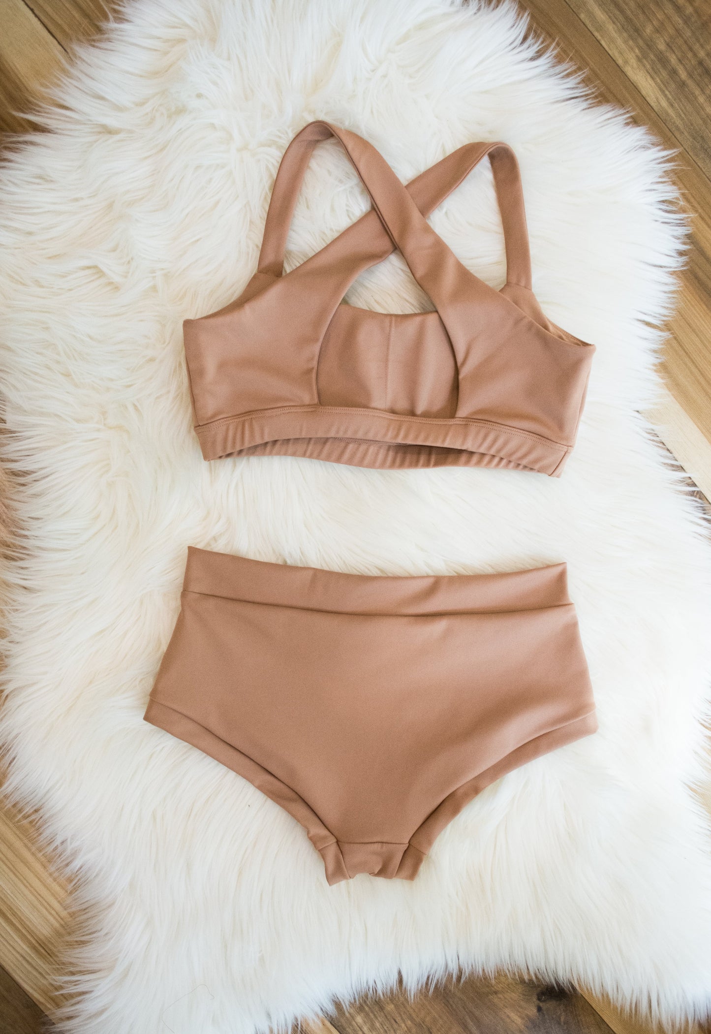 Nude colored pole dancing set with criss cross sports bra and high waisted pole shorts